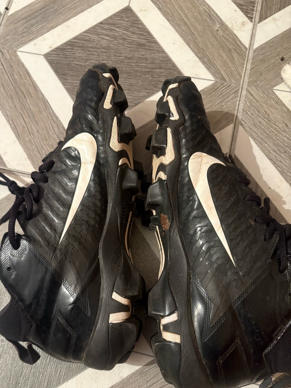 Nike  Men’s Black Athletic Cleats with White Swoosh
